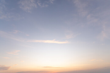 Fototapeta premium Low angle view and full frame of beautiful morning or evening blue and orange sky with cloudy while sunsets or sunrises taken at the sea used as natural blackground texture