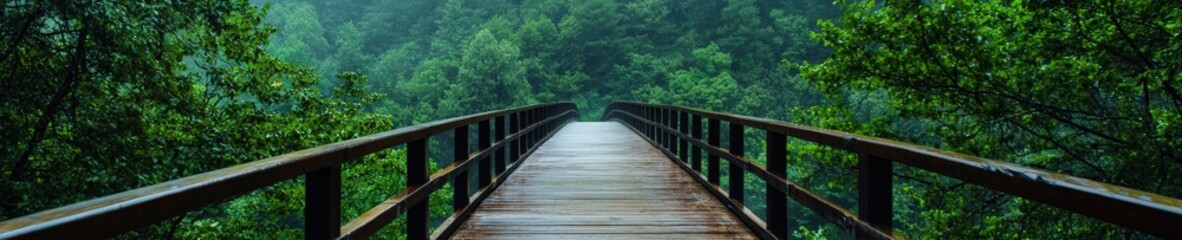 A scenic wooden bridge surrounded by lush green hills.