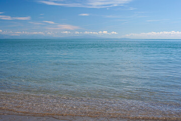 A tranquil ocean view from the Amalfi Coast, featuring calm blue waters with distant birds and...