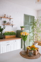 Aesthetic and Bright Fresh Kitchen Decor Featuring Charming Tulips and Colorful Fruits
