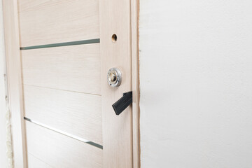 using multiple mounting wedges to install the door