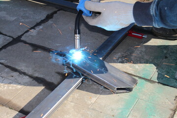 repair work with metal using a welding machine