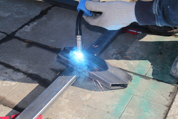 repair work with metal using a welding machine