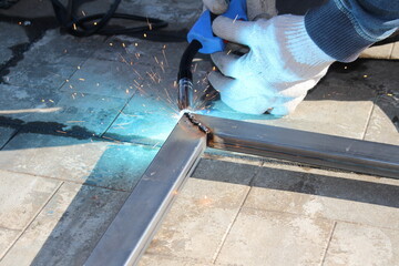 repair work with metal using a welding machine