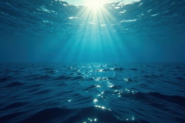 Obraz premium Deep-sea ocean landscape with dark blue surface and sunlight filtering down through the water, water, blue, sea