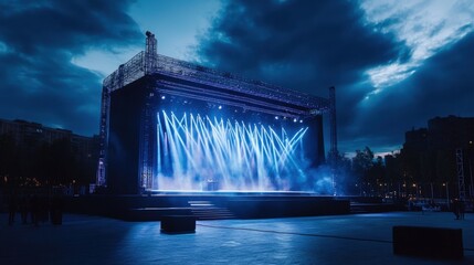 Large Concert Stage with Dramatic Blue Lighting and Spotlights