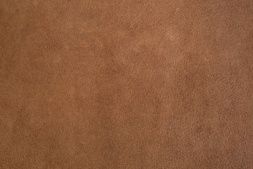 Genuine leather suede skin, textured surface, brown close up parchment structure , abstract backdrop