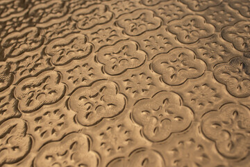 Floral pattern painted with golden  colored spray, abstract perspective backdrop