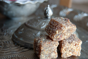 Traditional lokum candy in various flavors, dusted with sugar and arranged beautifully.