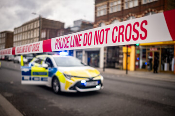 Police tape at the scene of a serious crime in west London- UK