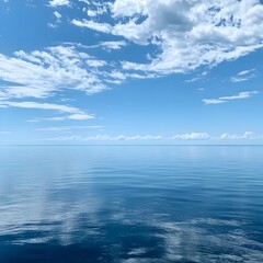 Obraz premium Photo of Calm Ocean Water under a Blue Sky