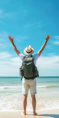 Young caucasian male traveler enjoying a beach day with backpack and hat under clear blue sky