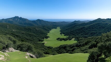 Fototapeta premium Vast valley nestled amidst rugged mountains, a verdant expanse
