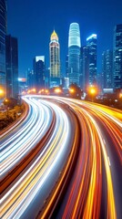 Obraz premium Night cityscape with a highway filled with light trails from cars. Tall skyscrapers in the background are illuminated. Vibrant colors and dynamic movement.