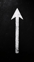 a tall white arrow pointing upward on a dark textured surface creating a bold visual navigation symbol with grit
