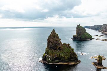 Duncansby Stacks, a breathtaking coastal wonder in Scotland, rise dramatically from the North Sea....