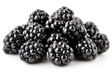 Fresh blackberries stacked together on a white surface highlighting their rich color and texture
