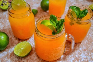 Fresh Passion Fruit Juice in Mason Jar: A mason jar filled with fresh passion fruit juice, garnished with lime slices and mint leaves