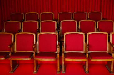 Fototapeta premium Vintage Theater Seats with Red Upholstery in Classic Cinema