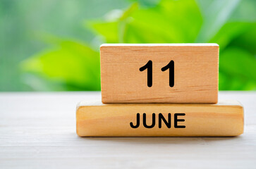 11 June wooden calendar with customizable space for text or ideas. June month concept.