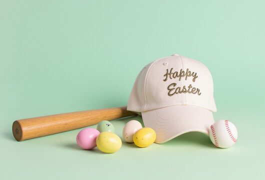 a beautifully embroidered cap with the phrase "Happy Easter" and a playful arrangement of eggs, a baseboll bat, and a ball.