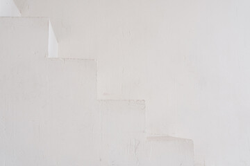 White Textured Staircase in a Minimalist Interior