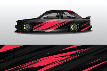 Obraz premium Sleek black and red sports car with dynamic graphics parked against a minimalist background