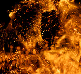 fire flame with sparks on black background.