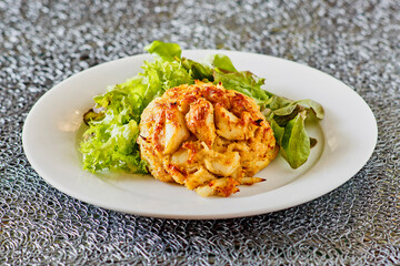 crispy fried crab cake with a side salad