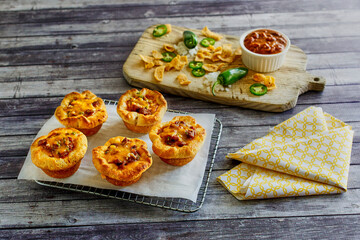 cornbread cups stuffed with ground beef, melted cheese, and green onions