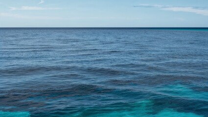 Obraz premium Gradient ocean water transitioning from deep blue to turquoise shades.