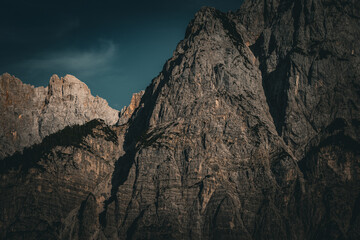 Dramatic Rocky Mountain Face in Low Light with Deep Shadows and Texture