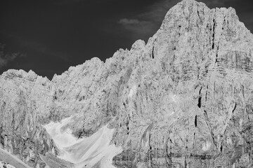 Black and White High-Contrast Mountain Landscape with Snow Patches