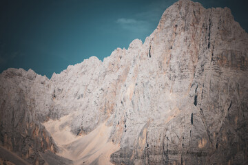 Detailed View of Rugged Rocky Mountain Wall Under Clear Sky