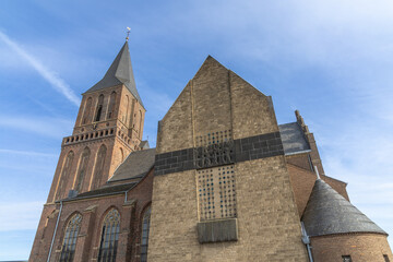 Fototapeta premium St. Martini Church Emmerich a brick building aganst a blue sky.