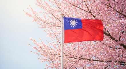 Naklejka premium Taiwan flag waving amidst cherry blossoms in springtime bloom