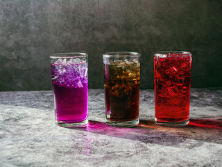 A lot of Soft drinks in colorful and flavorful glasses on the table,Glasses with sweet drinks with...