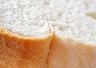 Fresh, soft and fragrant bread with brown edges macro food