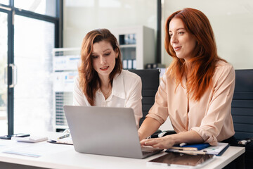 Marketing staff are analyzing the data to business planning at office.