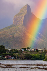 Beautiful view of the prominent Montagne du Rempart, also called the Matterhorn of the South, accompanied by a colorful rainbow just after the rain