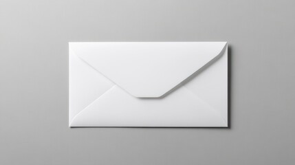 Studio shot of blank white envelope on a light gray surface ideal for messages