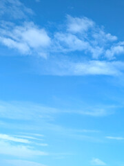 Wispy high-altitude delicate feathery white clouds in the sky