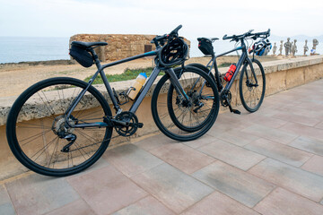 Obraz premium Cycle touring is a form of cycling focused on travel and adventure, Multi-day journeys and carrying necessary gear. Regular cycling encompass various activities like commuting, recreation, or sport. 