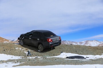 An accident car on beside road snowing day