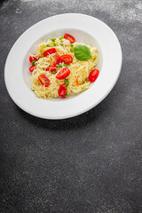 Pasta with tomatoes vermicelli vegetables dish fresh delicious gourmet food background on the table rustic food top view copy space