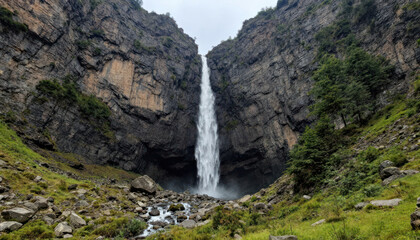 Naklejka premium Majestic Waterfall Cascading Down Sheer Cliffs