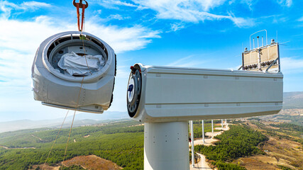 Aerial View of Wind Turbine Nacelle Being Lifted by Crane for Installation.