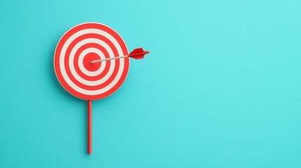Colorful dartboard with red and white circles and an arrow aimed at the center against a teal background