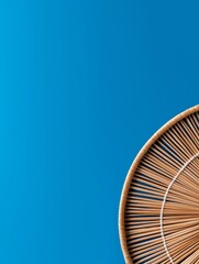 Woven texture against a bright blue background creates a vibrant visual contrast.