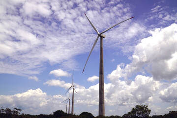 Brazilian wind farm, windfarm, wind turbine on concrete pillars on the Atlantic coast. Green energy...
